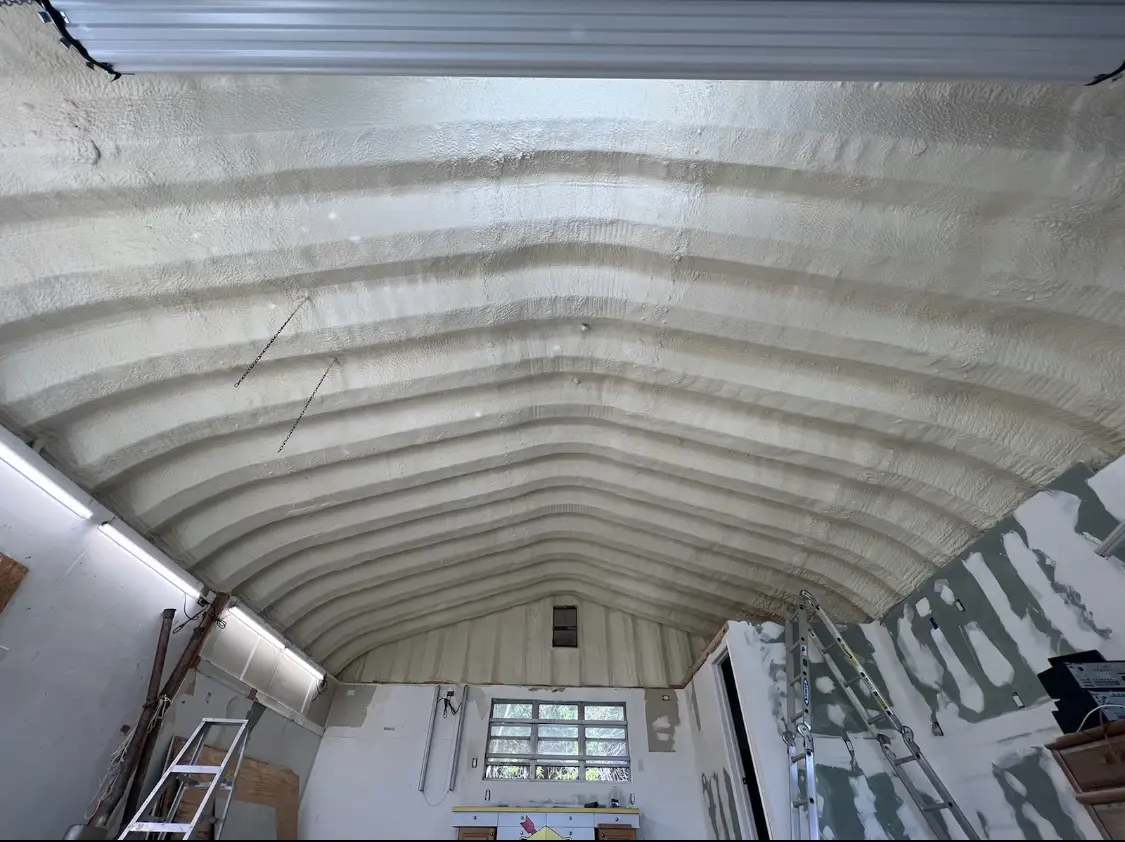 Spray polyurethane foam applied to the underside of a metal roof deck in New Kingman-Butler